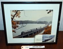 Framed color photo of bridge over Doodletown Bight with northbound CR OCS train 1988